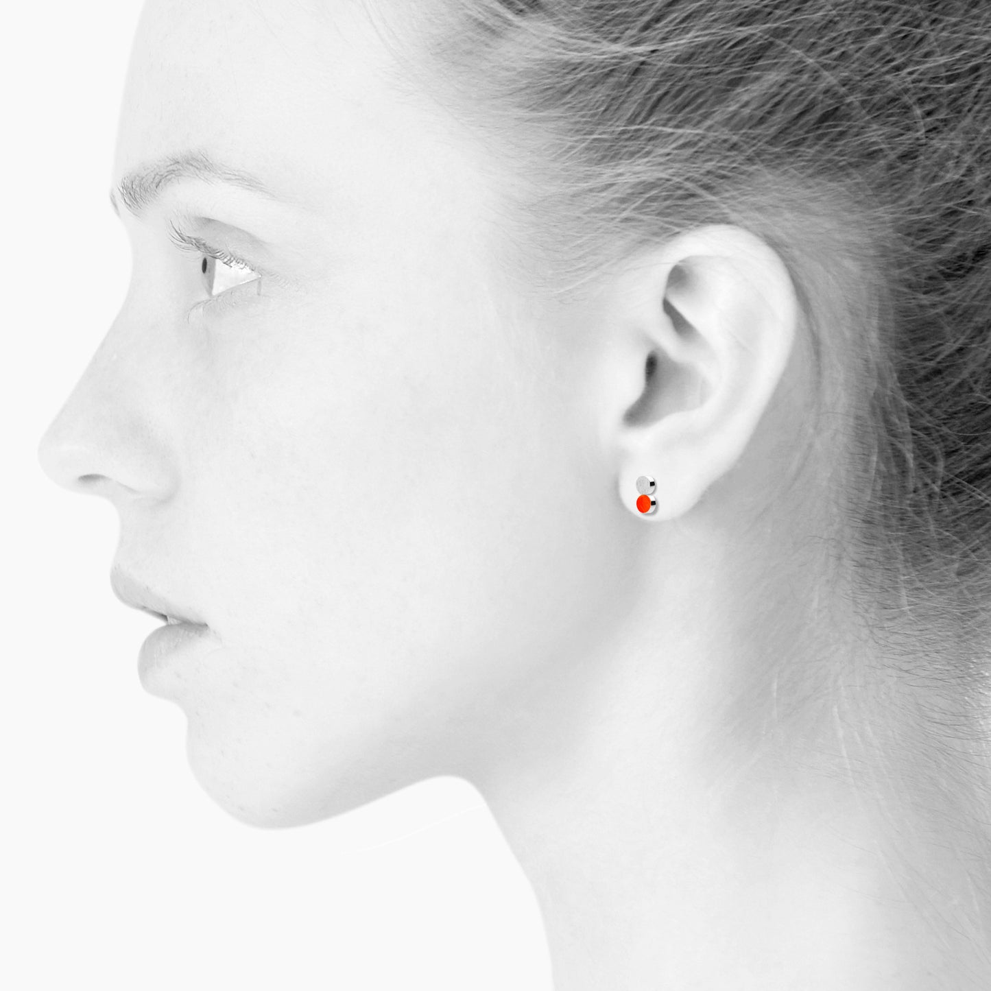 Sign Dotty nano earrings. Neon red orange. Sterling silver. Scherning Copenhagen